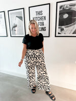 Squiggle print trousers white